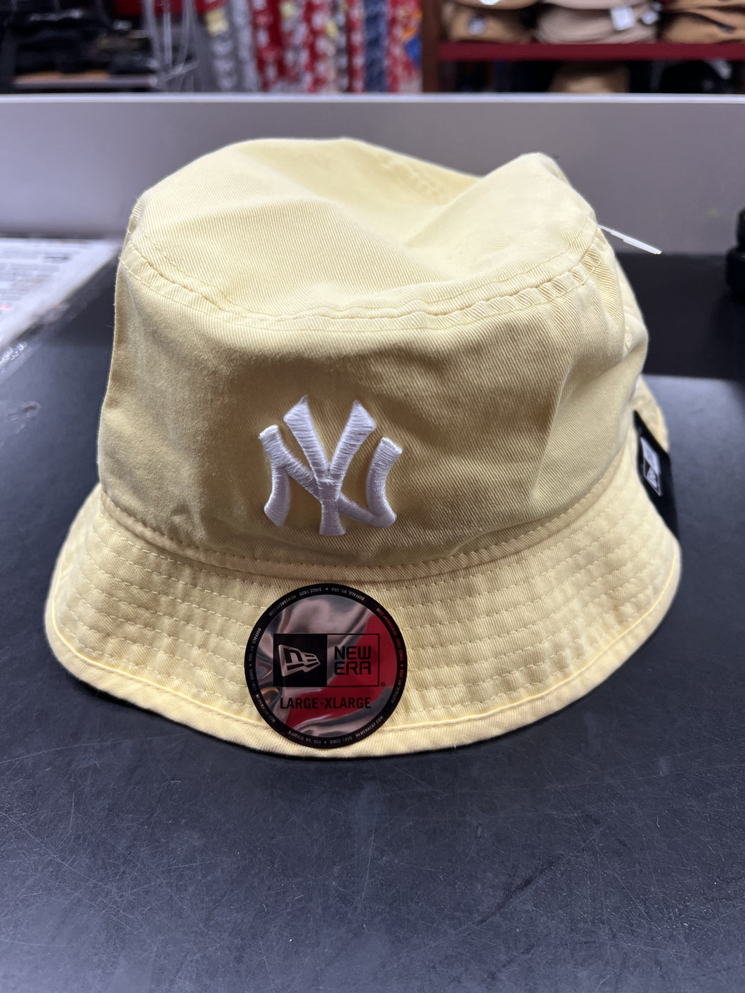 NE ERA BUCKET HAT YELLOW NY 13058263